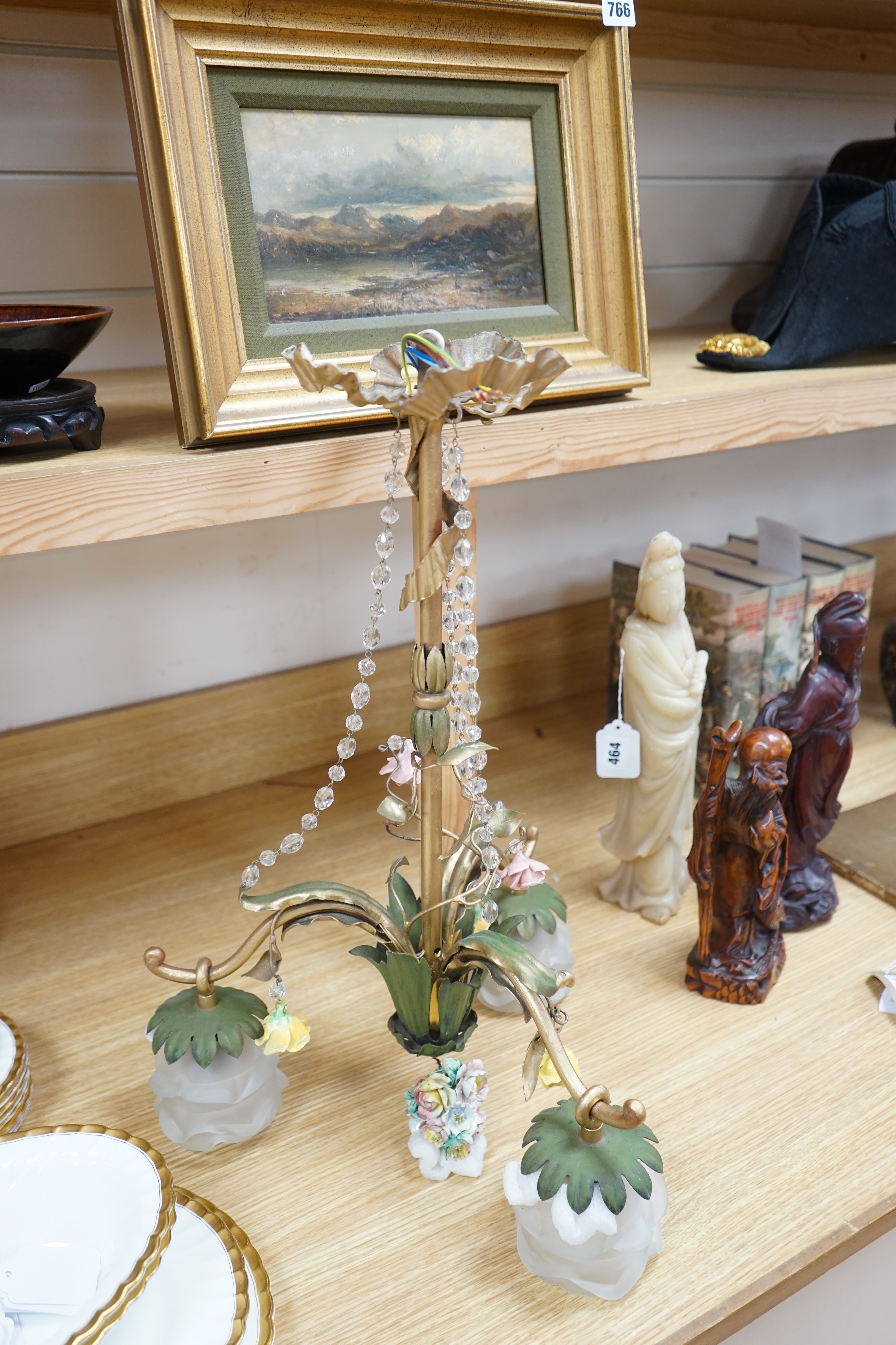 A French three arm coloured wrought iron ceiling light with frosted petal shades and porcelain flower decoration, circa 1930’s, 57cm high, 36cm across. Condition - fair